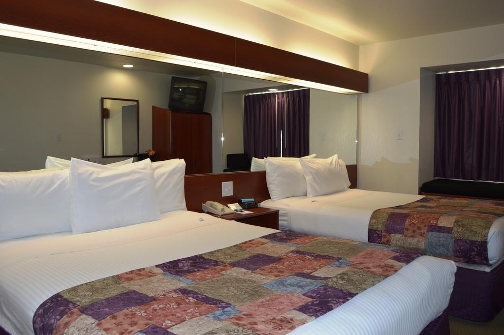 Microtel Inn And Suites By Wyndham Miami Ok Rum bild